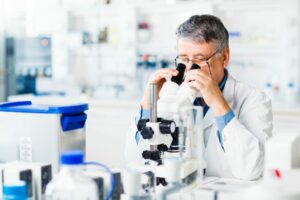 A man in a white lab coat