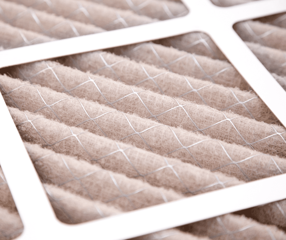 Dirty filter mesh, light brown, with white frame and wire grid.