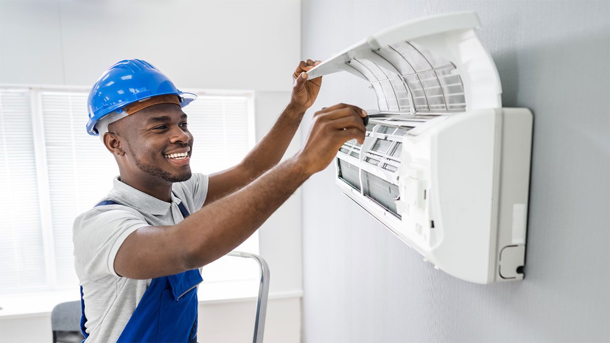 Man fixing ductless unit